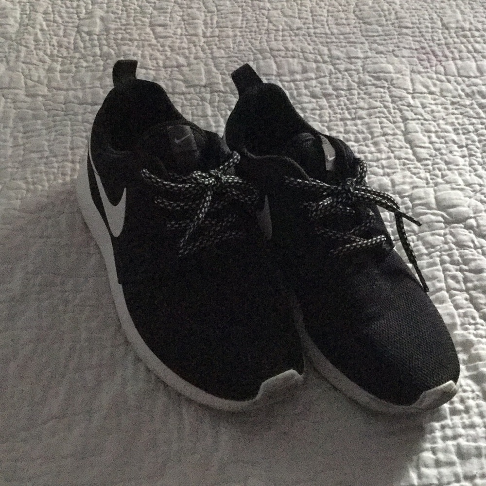 Black and white nike running shoes